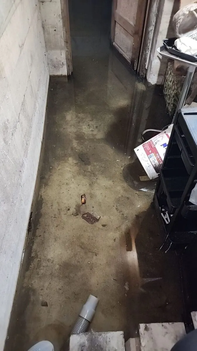 Flooded room with dirty water